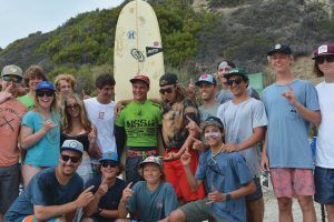 The Manasquan High School Surfing Team celebrates Fortney’s championship win
