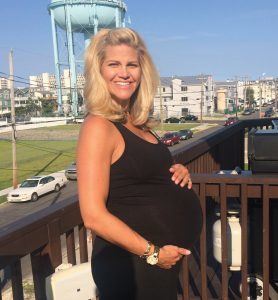 Katie Fehlinger showing off her baby bump at the Shore