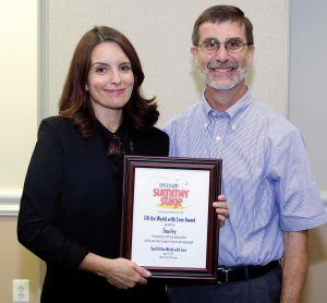Fey receiving the “Fill the World with Love Award” from Harry Dietzler, founder and executive director of Upper Darby Summer Stage