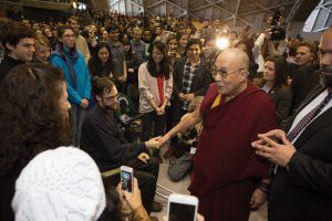 The Dalai Lama greets students and guests 