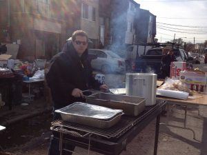 Chef George Kyrtatas of SweetWater Bar and Grill in Cinnaminson serves food in Staten Island after the storm 