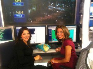 Meteorologists Kate Bilo and Kathy Orr snack before going on air