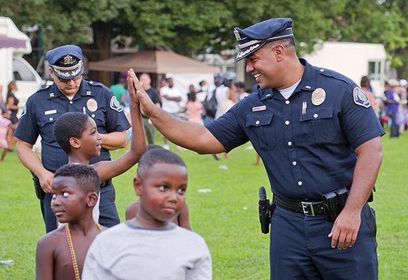 Camden County, New Jersey Police Officer high-five's local kid